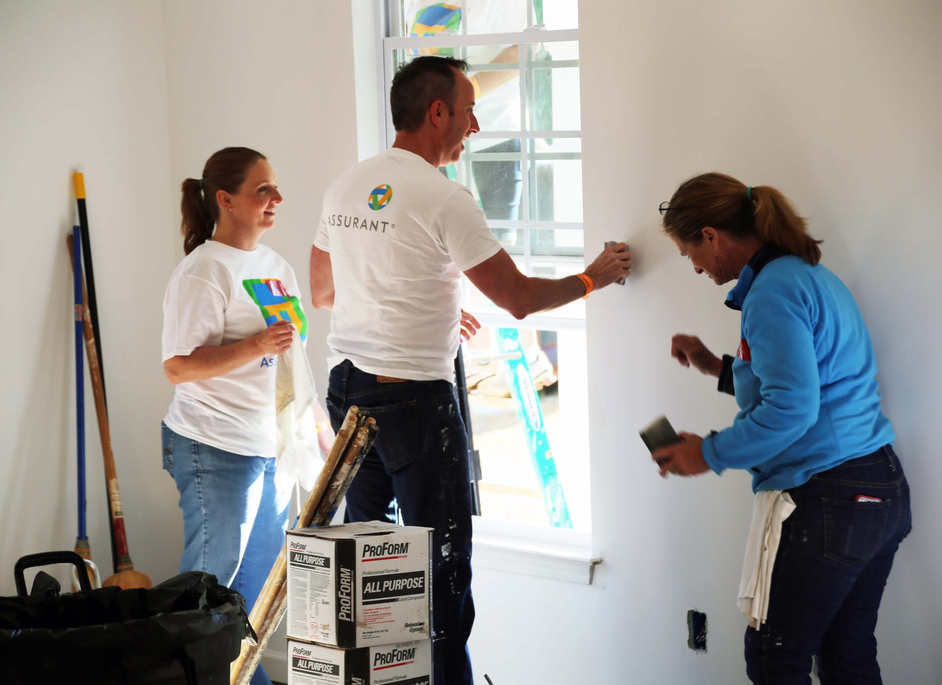 AssurantCares Assurant cares and team member work together to build homes for others